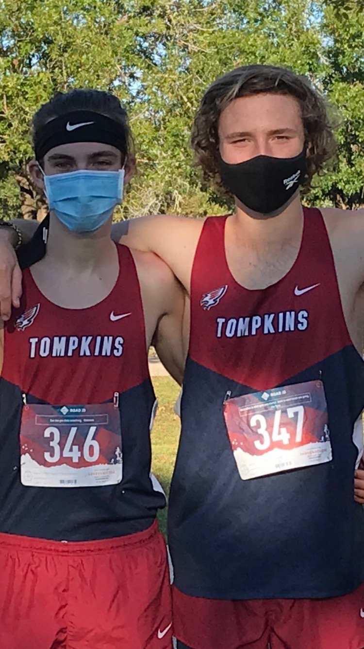 From left to right, Tompkins seniors Gaavin Sacke and Ben Smith helped the Falcons boys capture their third district team championship in the last four years.